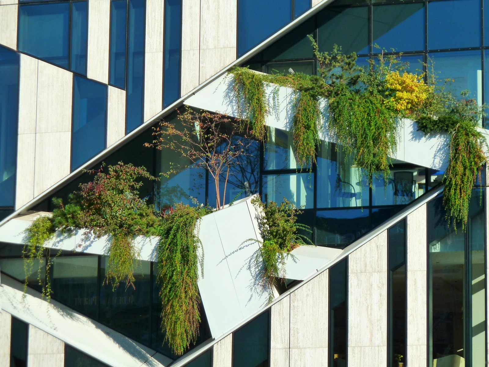 Green spaces on the facade of the Koe -Bogen shopping center and Breuninger department store in Dusseldorf, Germany.